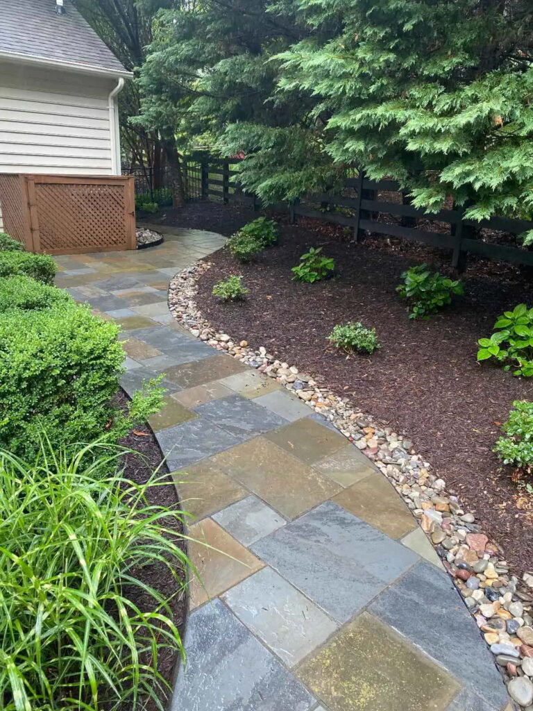 small river stone beside patio